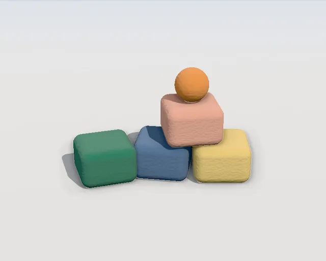 Stacked clay building blocks with an orange ball on top
